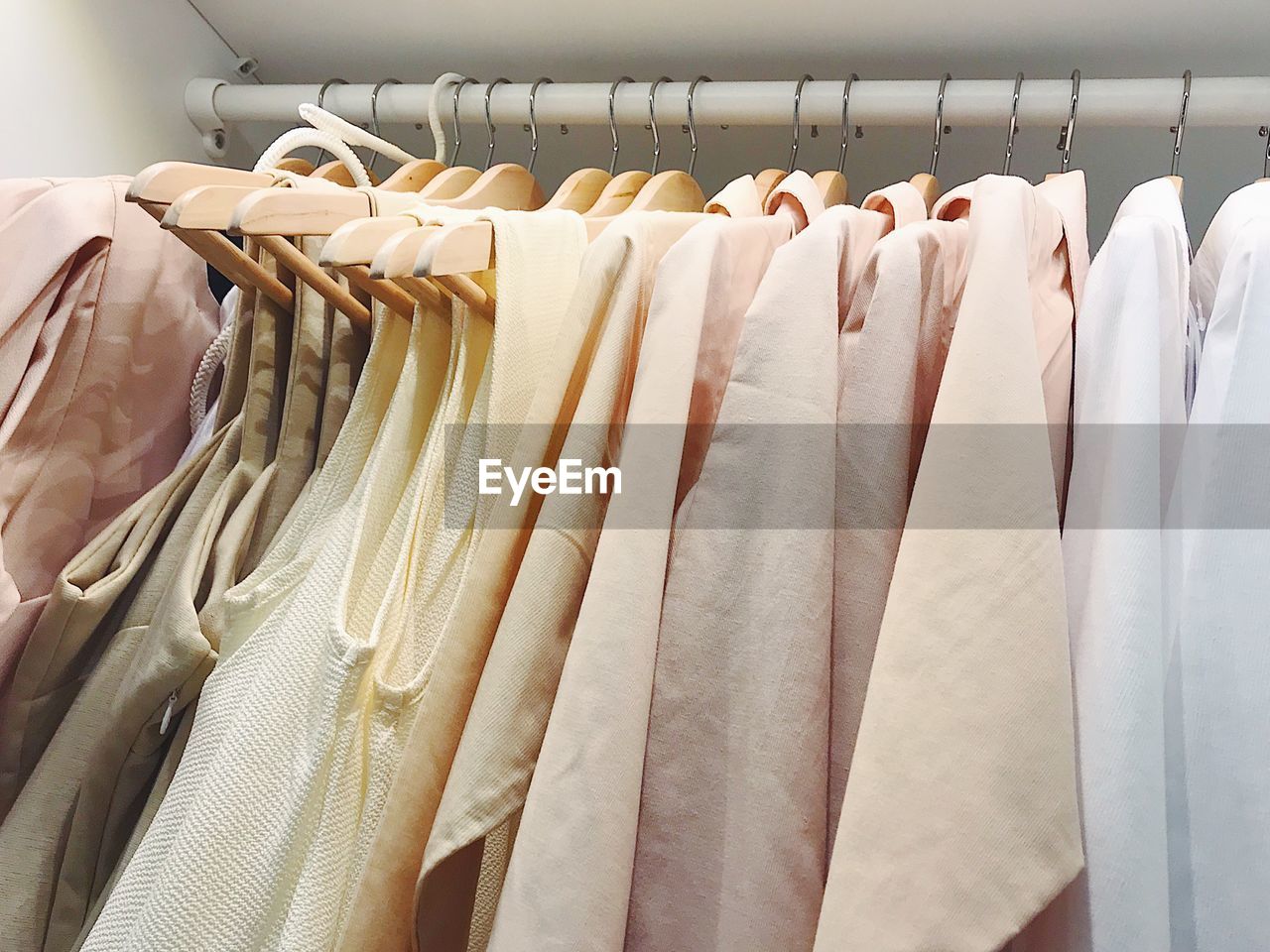 PANORAMIC VIEW OF CLOTHES HANGING AT STORE