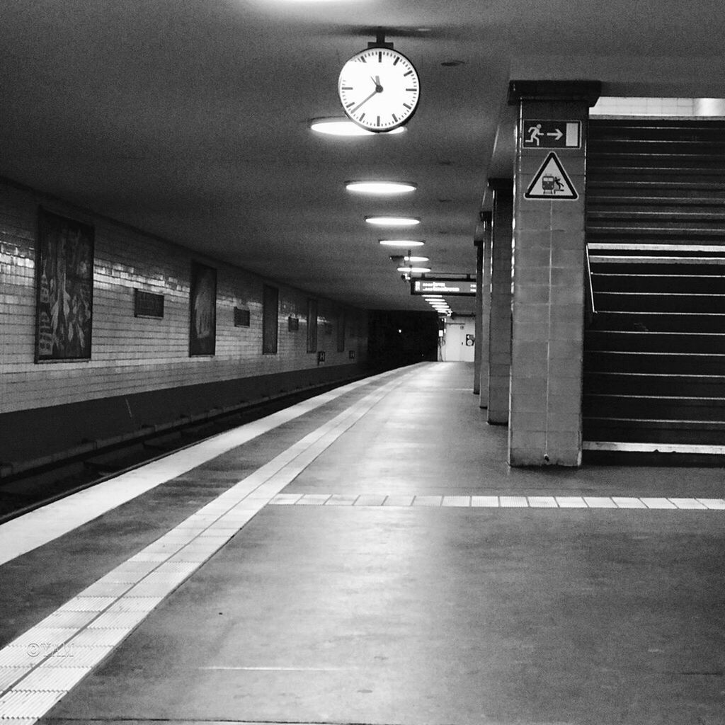 ILLUMINATED RAILROAD STATION PLATFORM AT SUBWAY