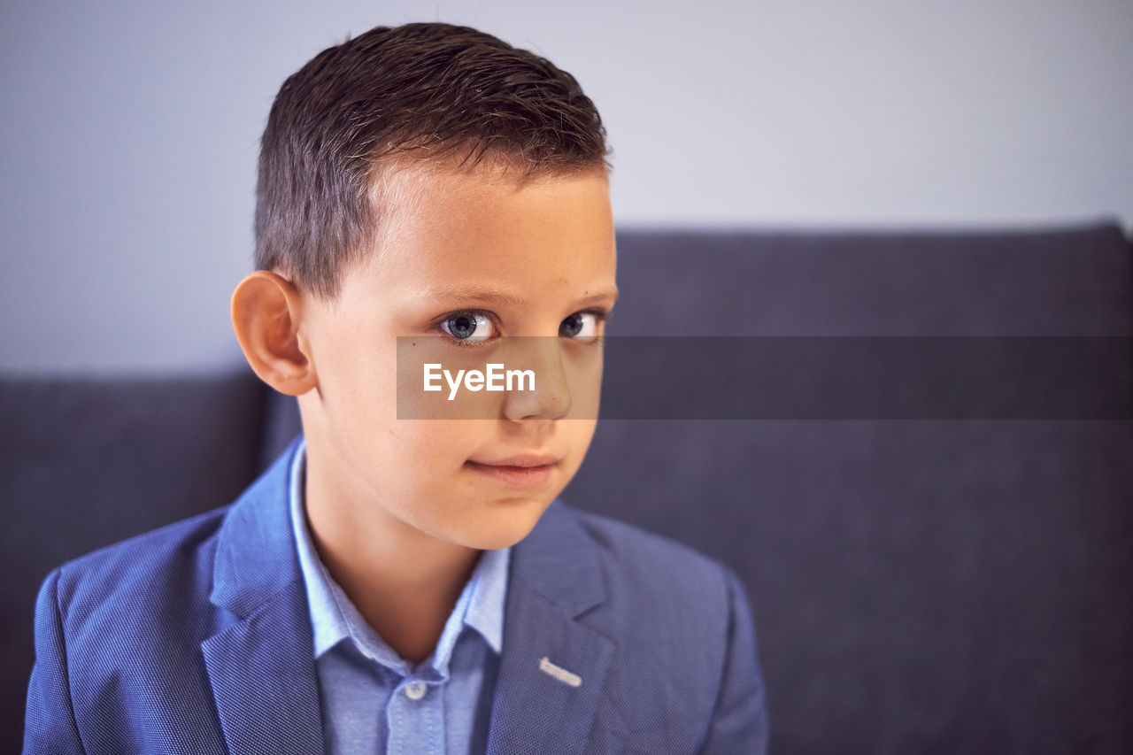 Close-up portrait of boy at home