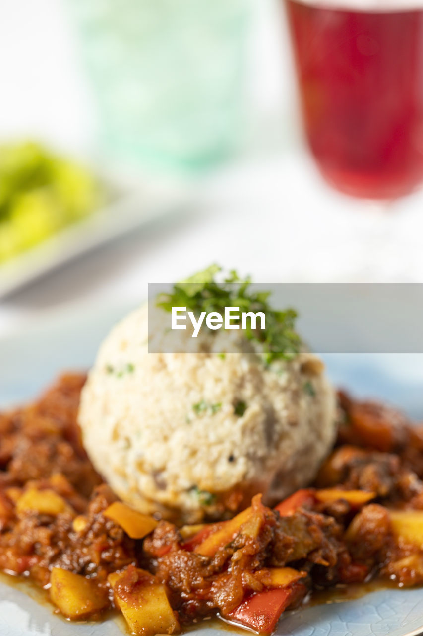 CLOSE-UP OF FOOD SERVED ON TABLE