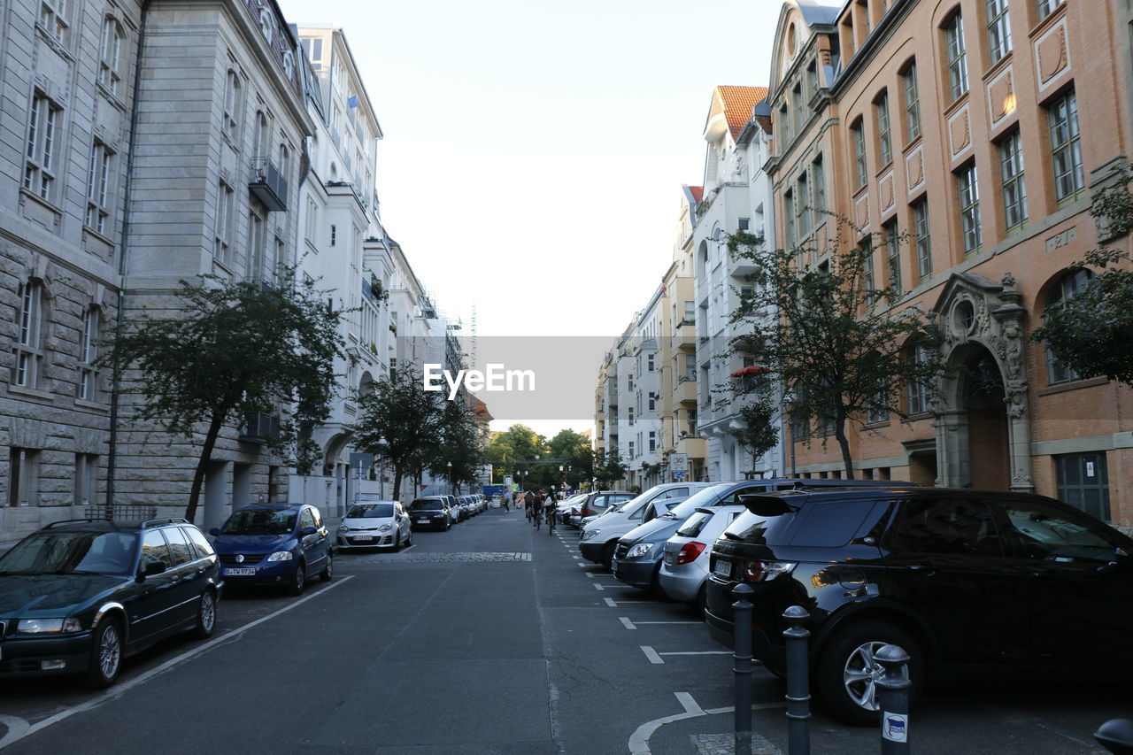 Cars on street amidst buildings in city