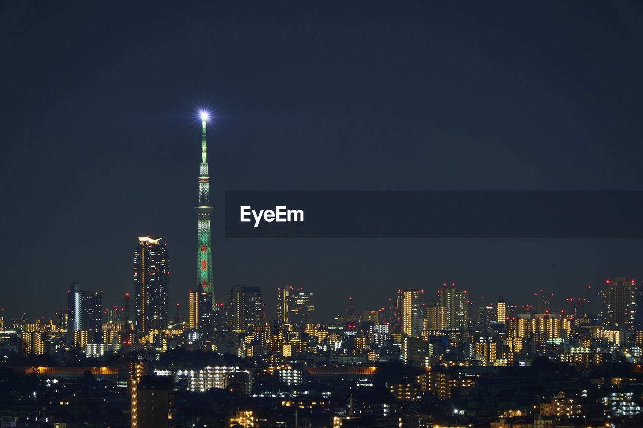 Illuminated buildings in city at night