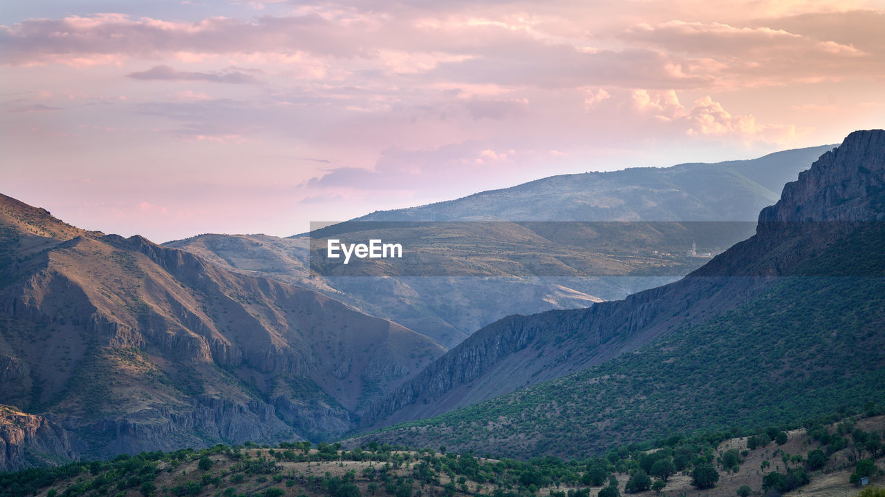 Scenic view of mountains against sky during sunset