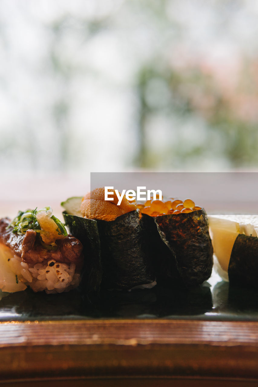 CLOSE-UP OF SUSHI ON TABLE