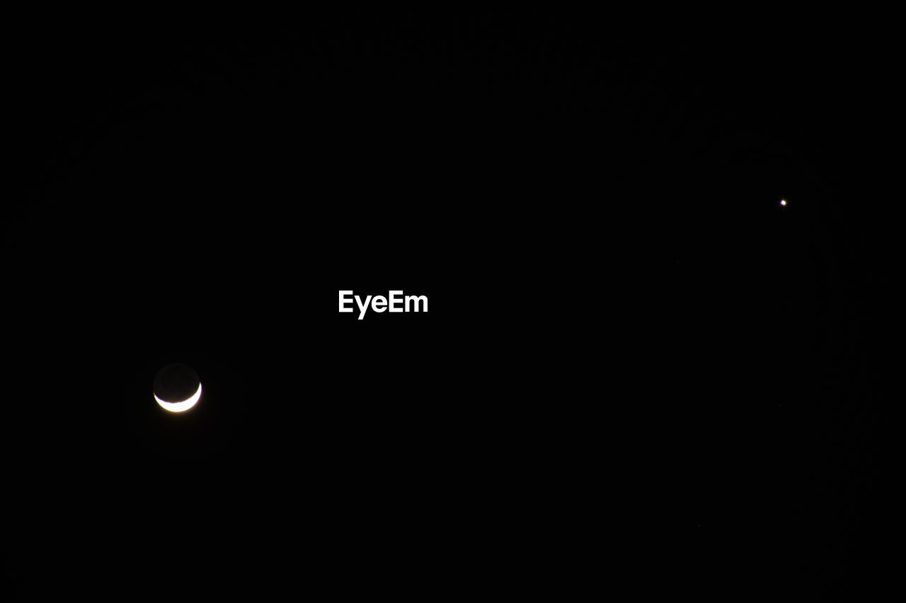 LOW ANGLE VIEW OF MOON AGAINST SKY