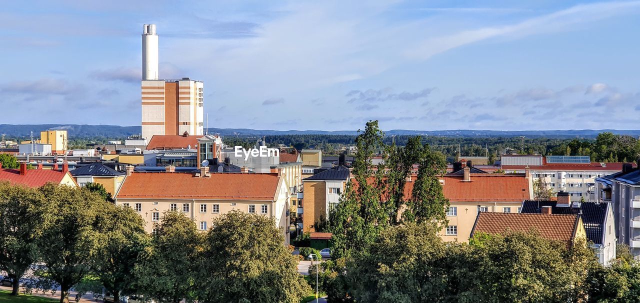 High angle view of buildings in city against sky