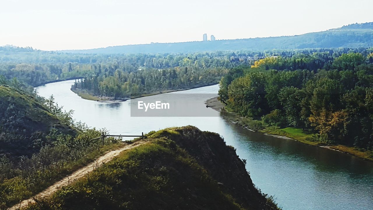 Scenic view of river passing through forest