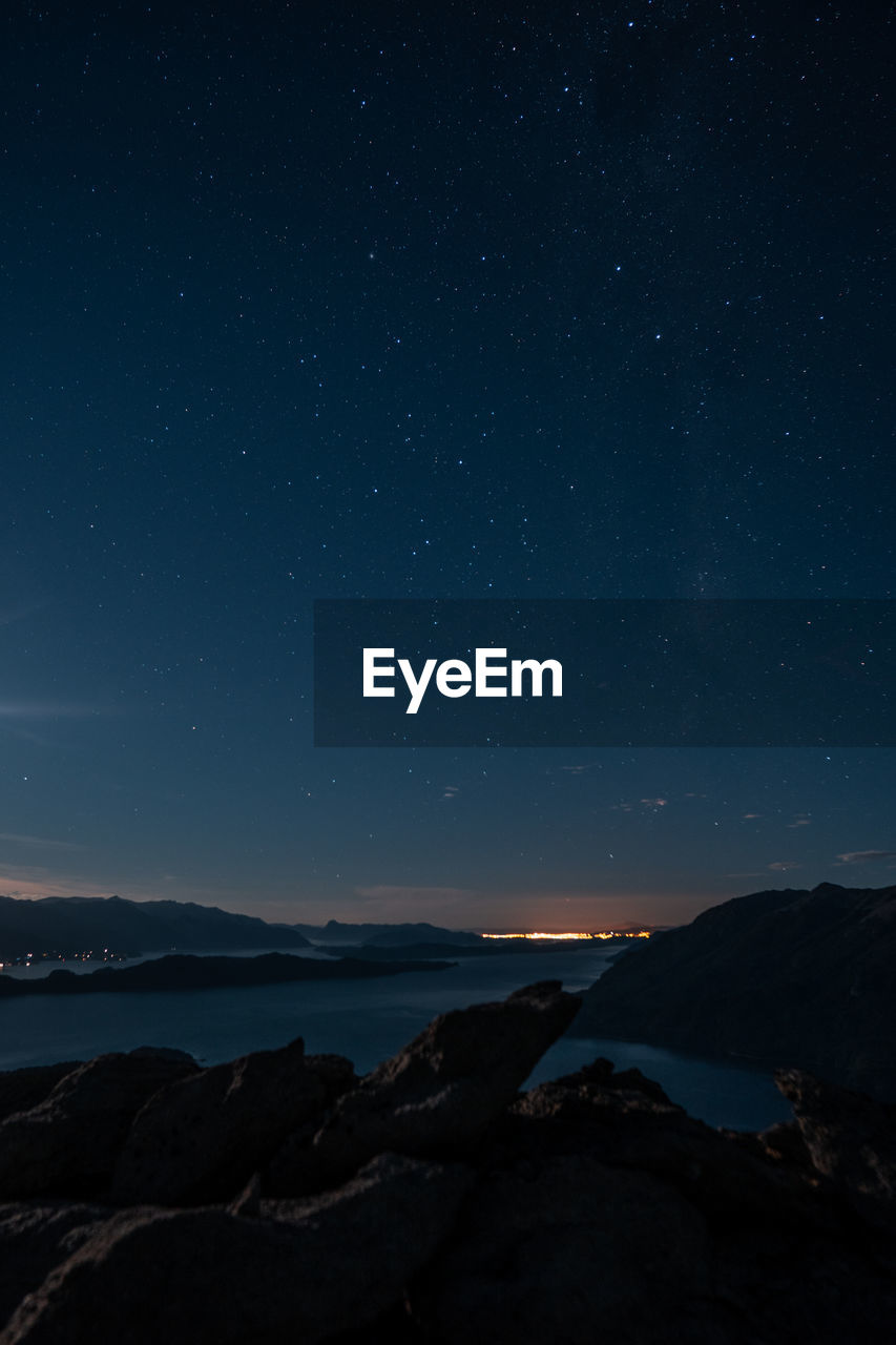 Scenic view of the lake against sky at night