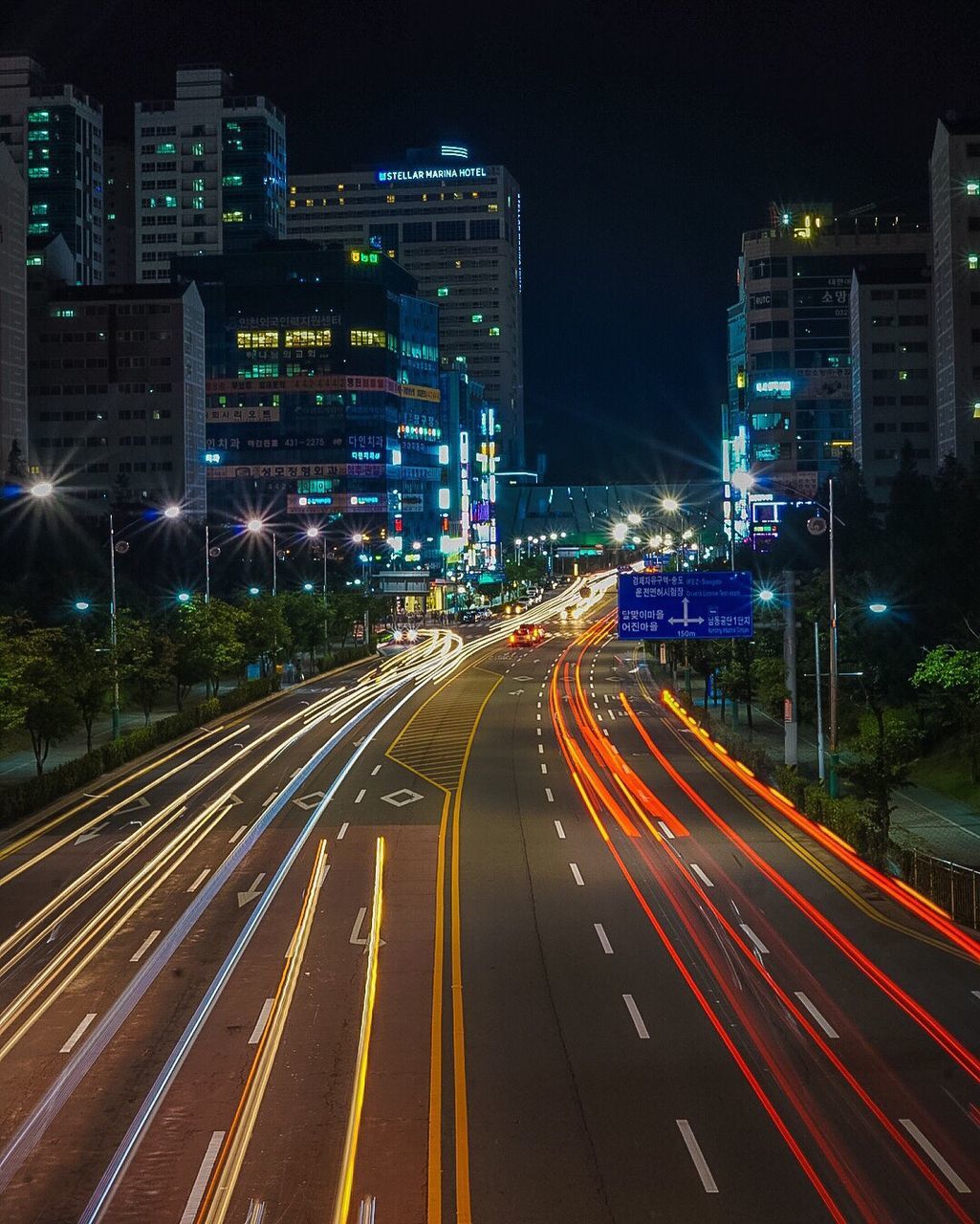 Illuminated city street at night