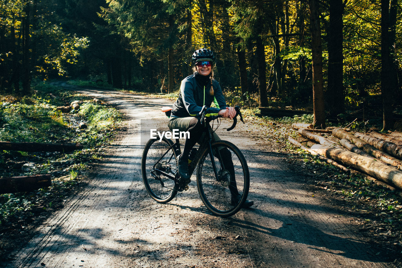 Portrait of a woman with a gravel bike