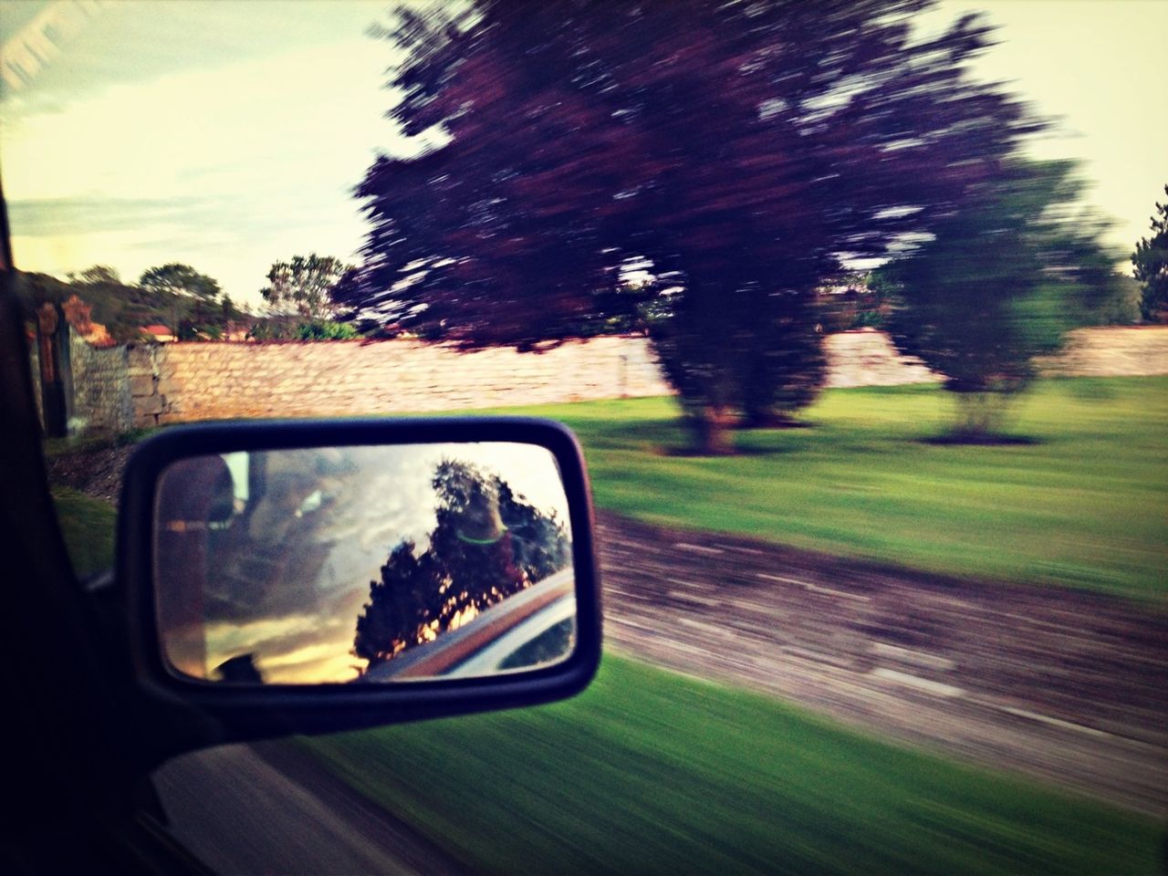 ROAD SEEN THROUGH CAR WINDSHIELD