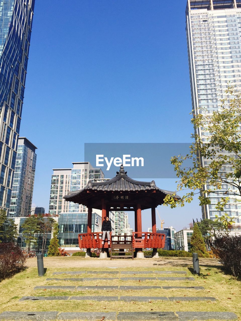 Low angle view of buildings against clear blue sky