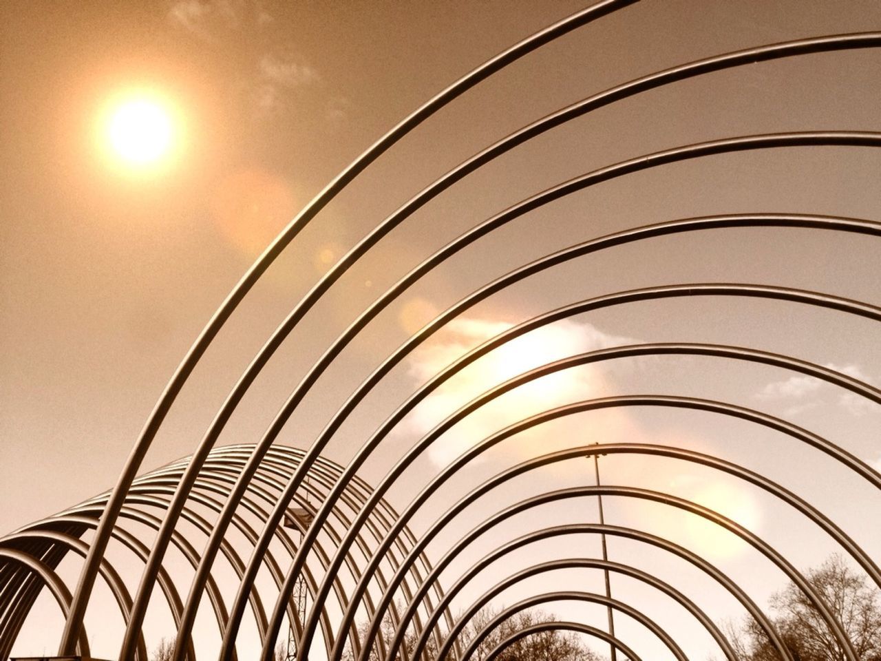 LOW ANGLE VIEW OF MODERN BUILDING AGAINST SKY