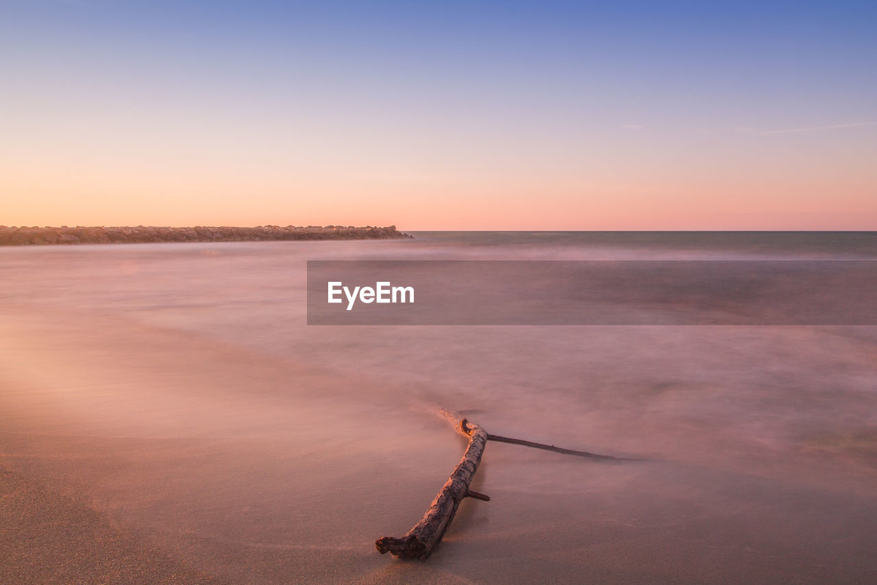 Scenic view of sea against clear sky