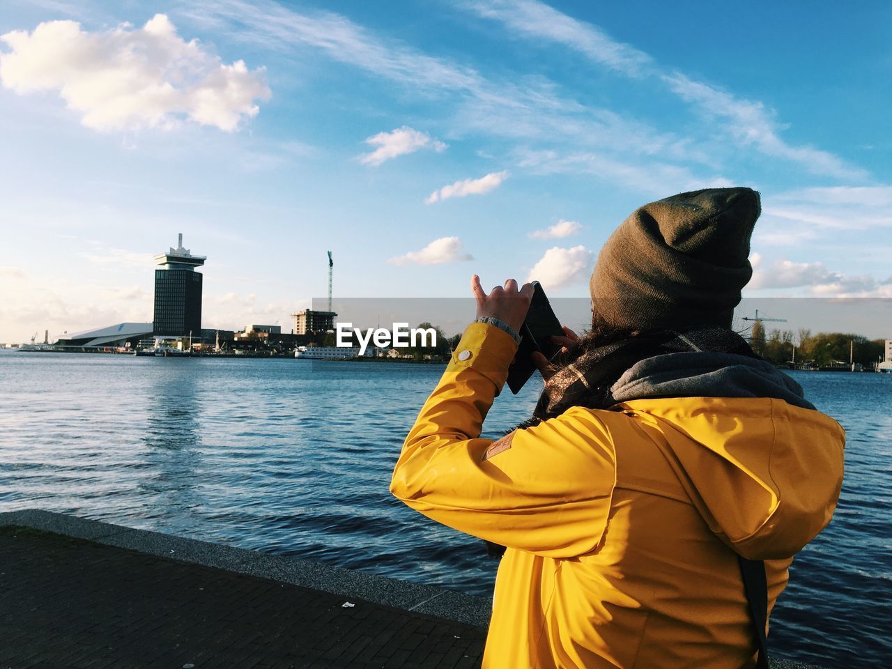 Woman photographing with mobile phone