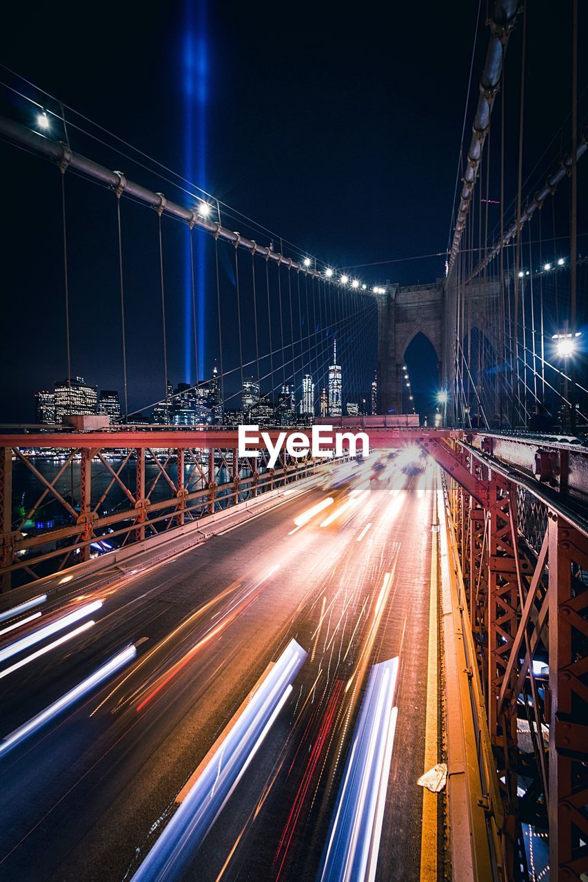 Light trails on suspension bridge at night