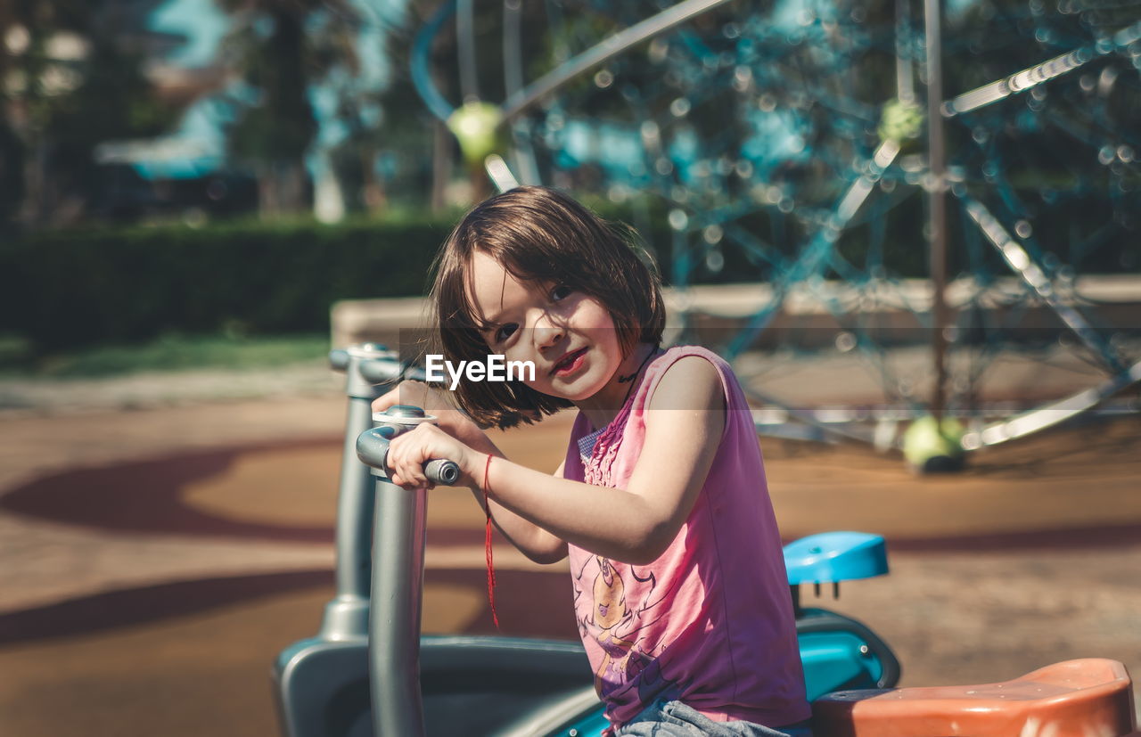 Portrait of smiling girl playing outdoors