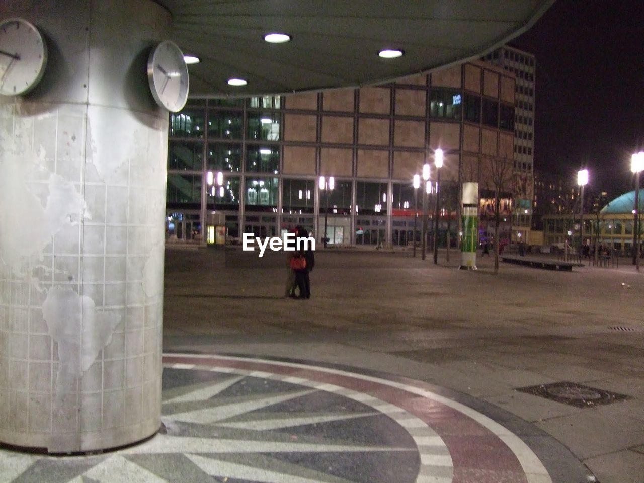 WOMAN IN CITY AT NIGHT