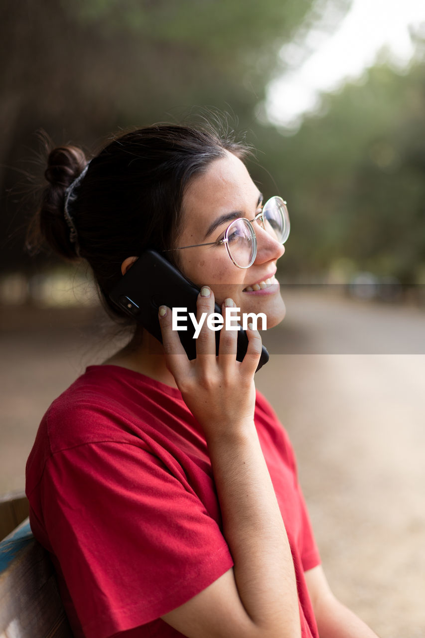 Portrait of woman using mobile phone