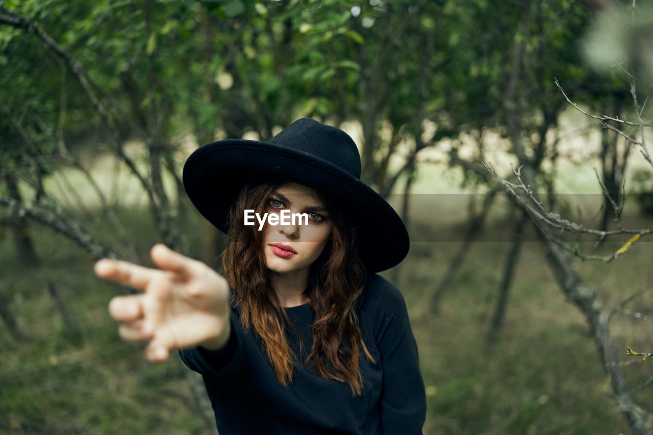 young woman wearing hat