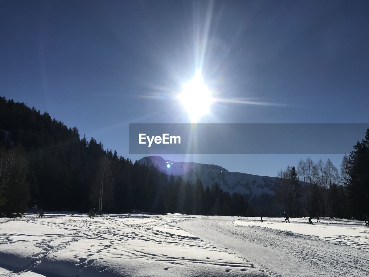 Scenic view of snow covered landscape against sky