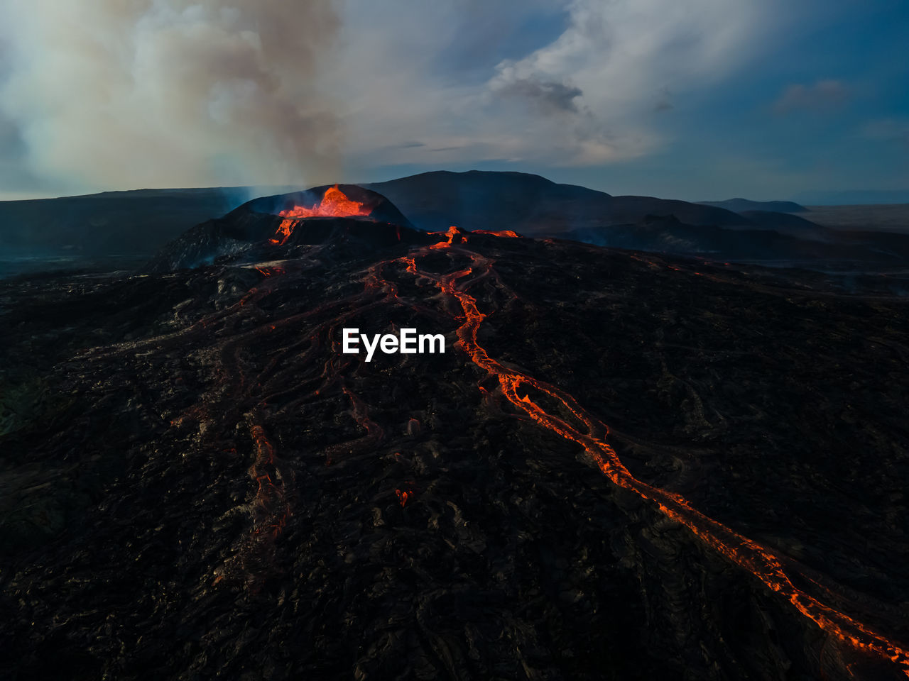 Aerial view of snowcapped mountain against sky