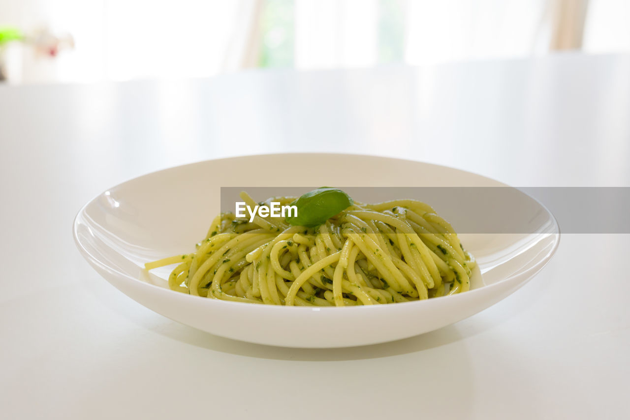 Close-up of pasta in plate on table