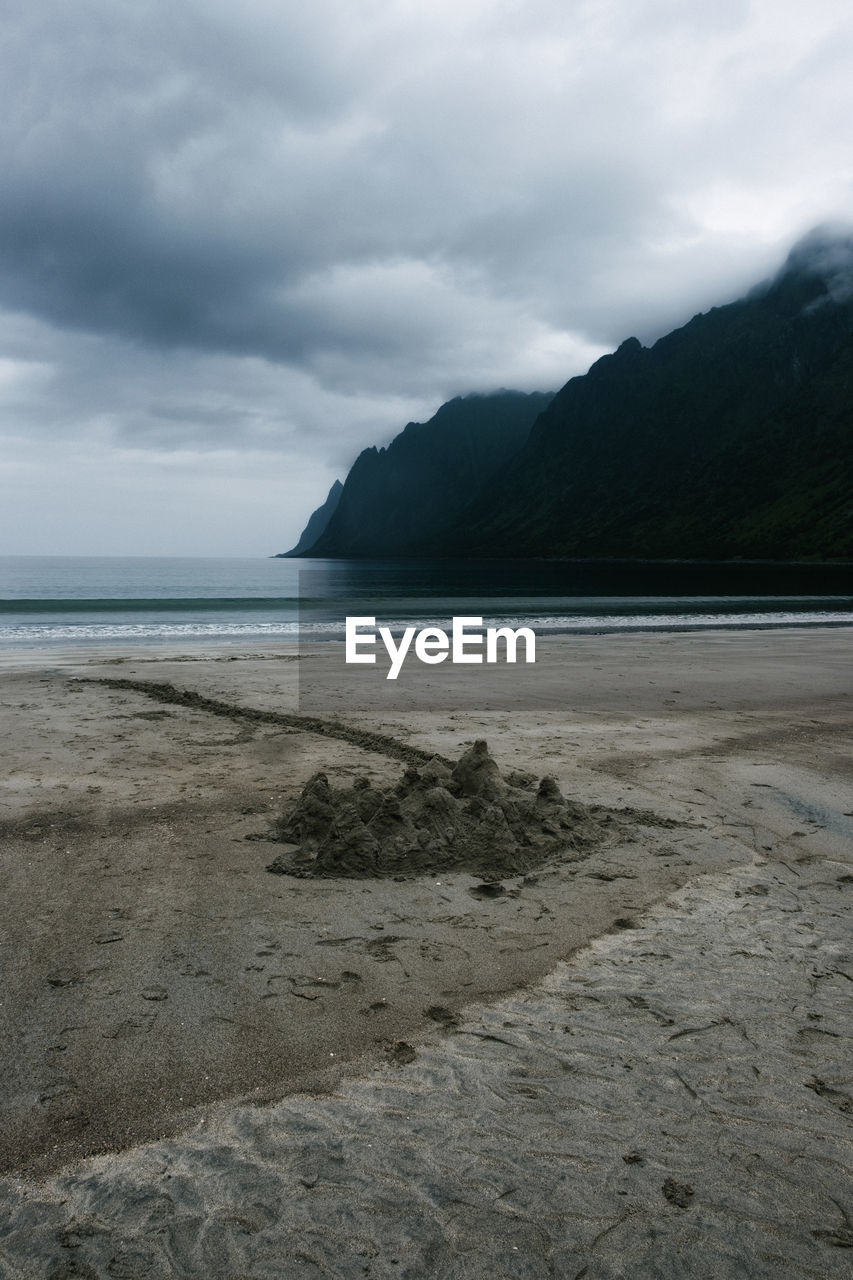 Scenic view of sandcastle at the beach against sky