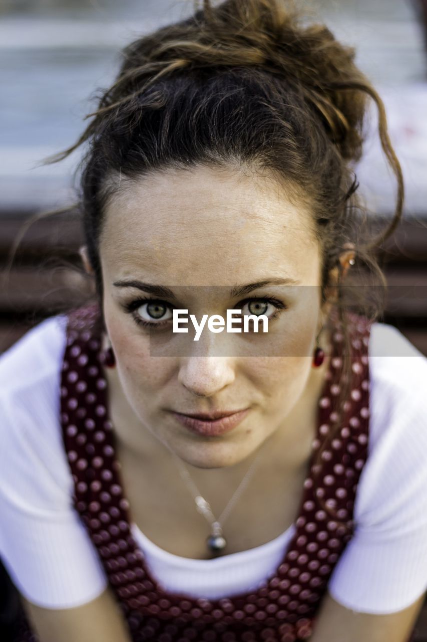 Close-up portrait of young woman sitting