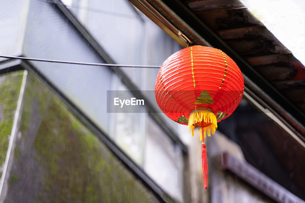 lantern, red, lighting equipment, chinese lantern, hanging, architecture, tradition, built structure, chinese new year, yellow, no people, low angle view, chinese lantern festival, building exterior, decoration, event, festival, outdoors, day, celebration, flower, city, light, nature
