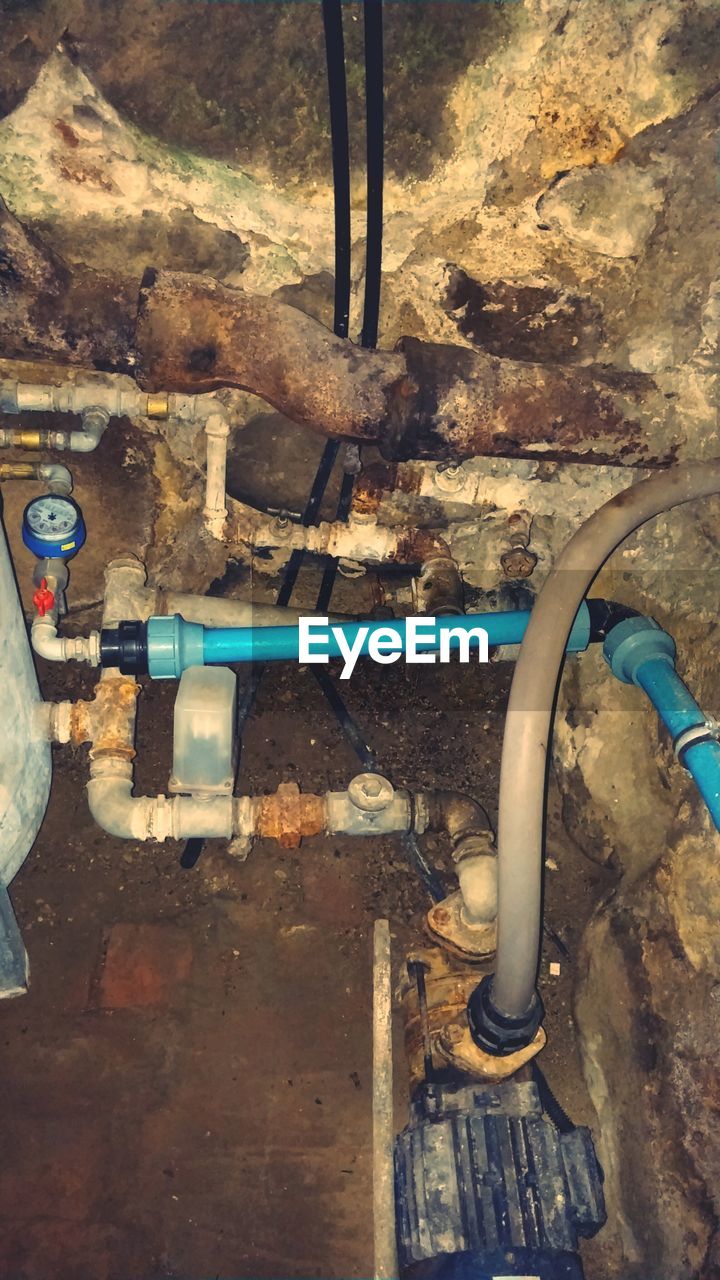 High angle view of pipes in abandoned room