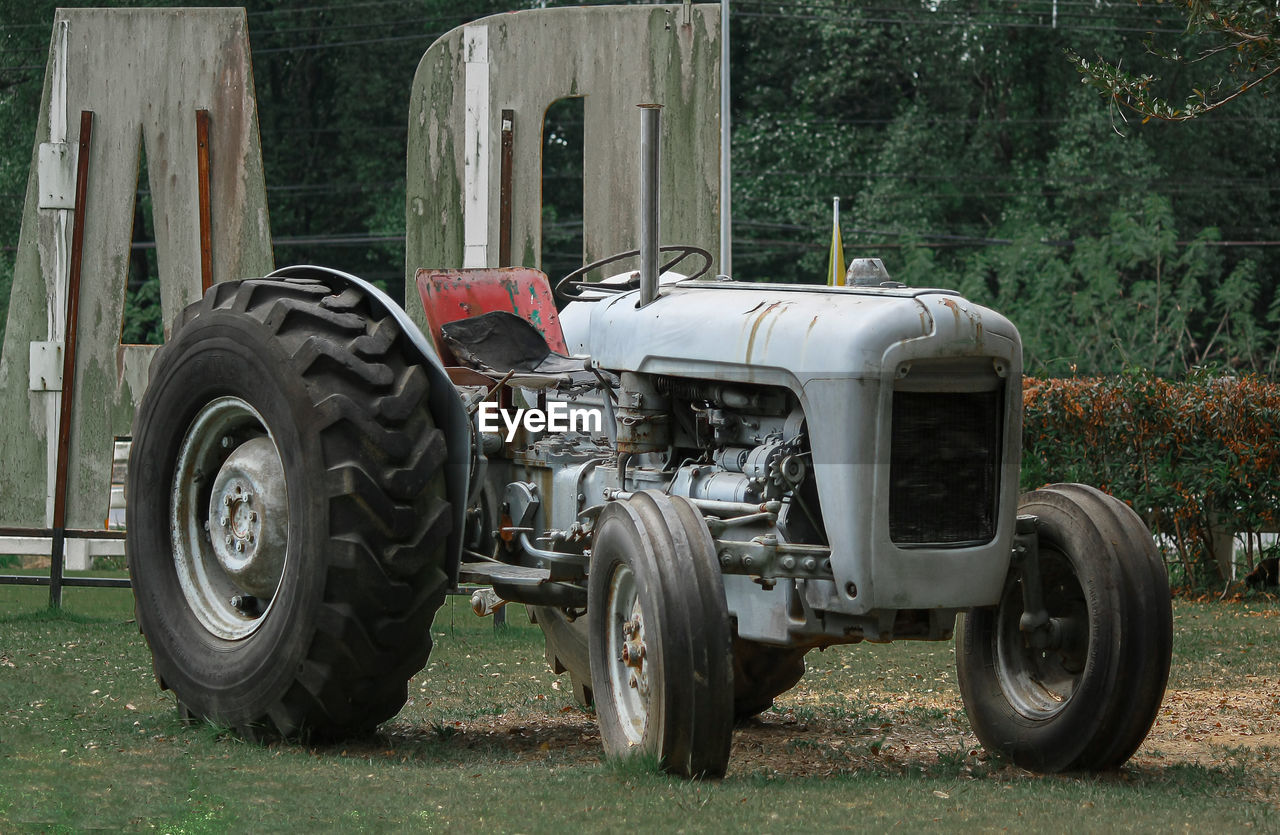 ABANDONED VEHICLE ON FIELD