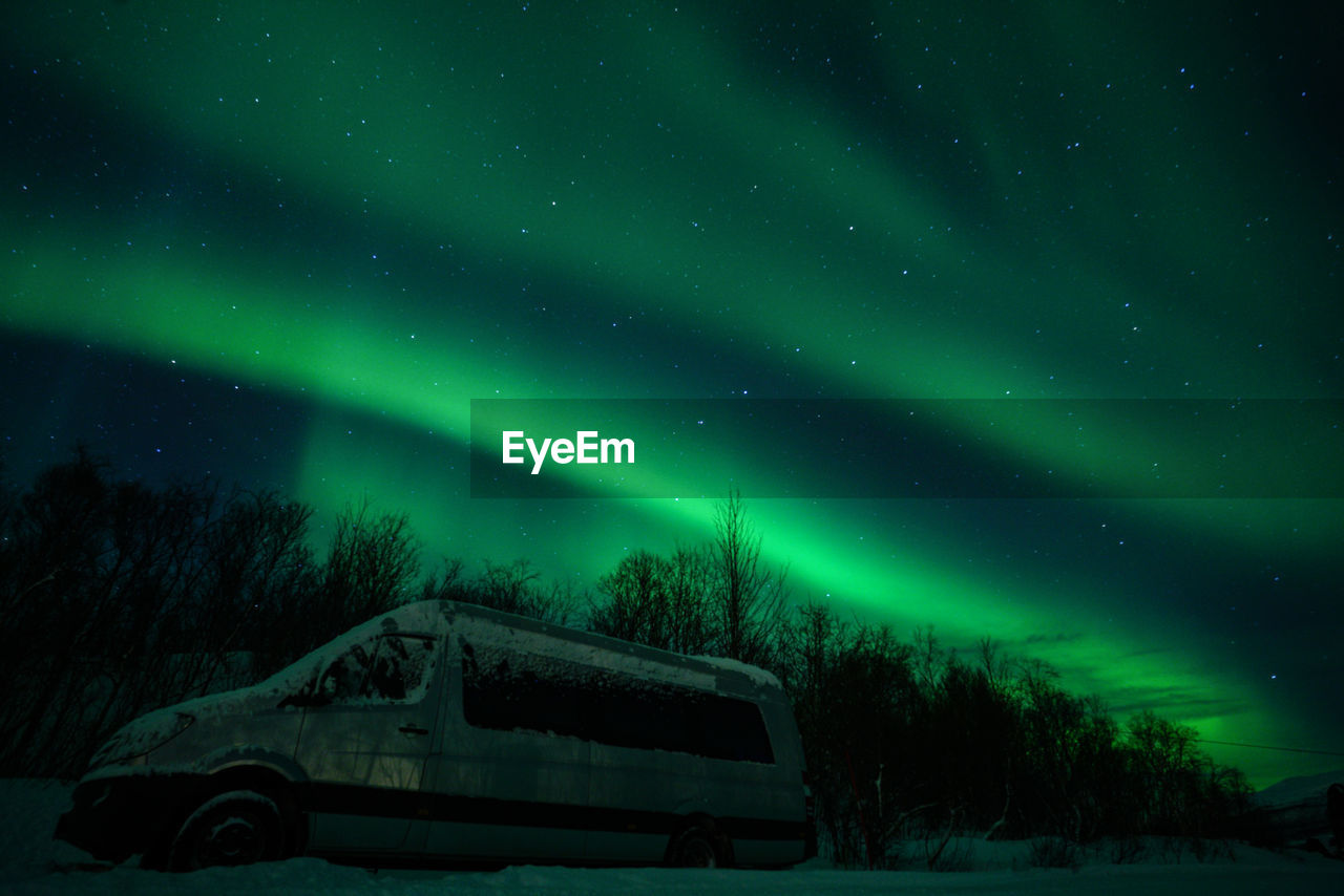 Low angle view of aurora borealis at night