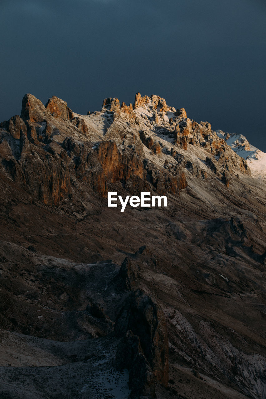 Rock formation on land against sky