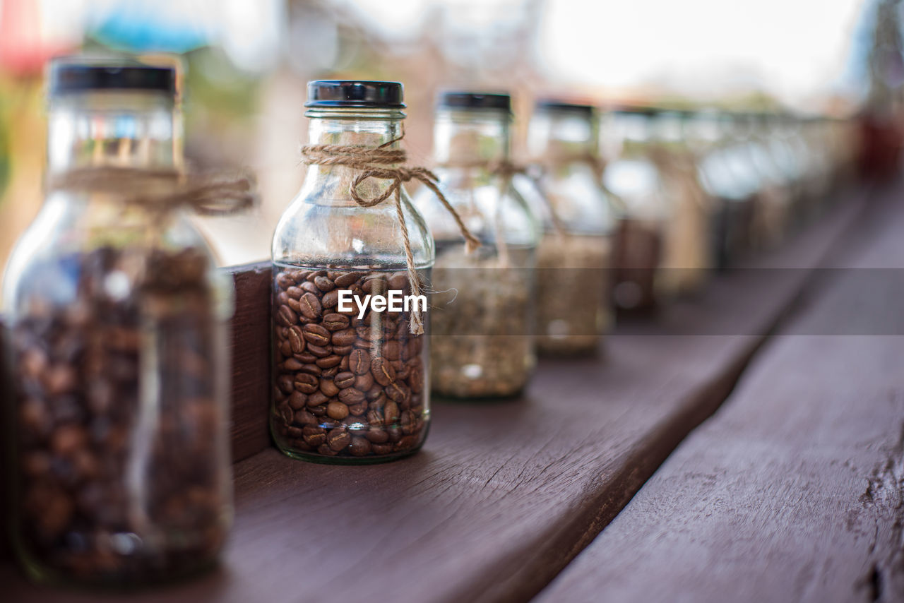 Rows of coffee in glass bottles concept of different types of coffee