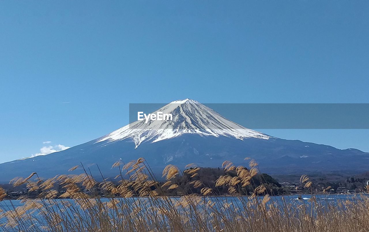 SNOWCAPPED MOUNTAIN AGAINST CLEAR BLUE SKY