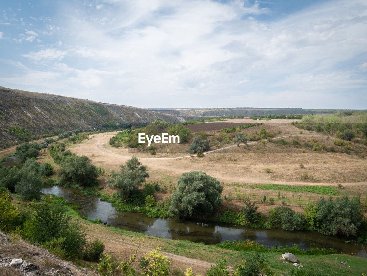 landscape, environment, sky, scenics - nature, hill, plant, nature, cloud, land, beauty in nature, rural area, reservoir, no people, tree, water, plateau, tranquility, valley, non-urban scene, tranquil scene, day, rural scene, outdoors, travel, travel destinations, field, grass, agriculture, lake, horizon