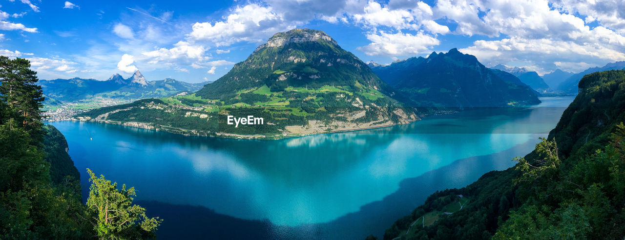 Panoramic view of lake and mountains against sky