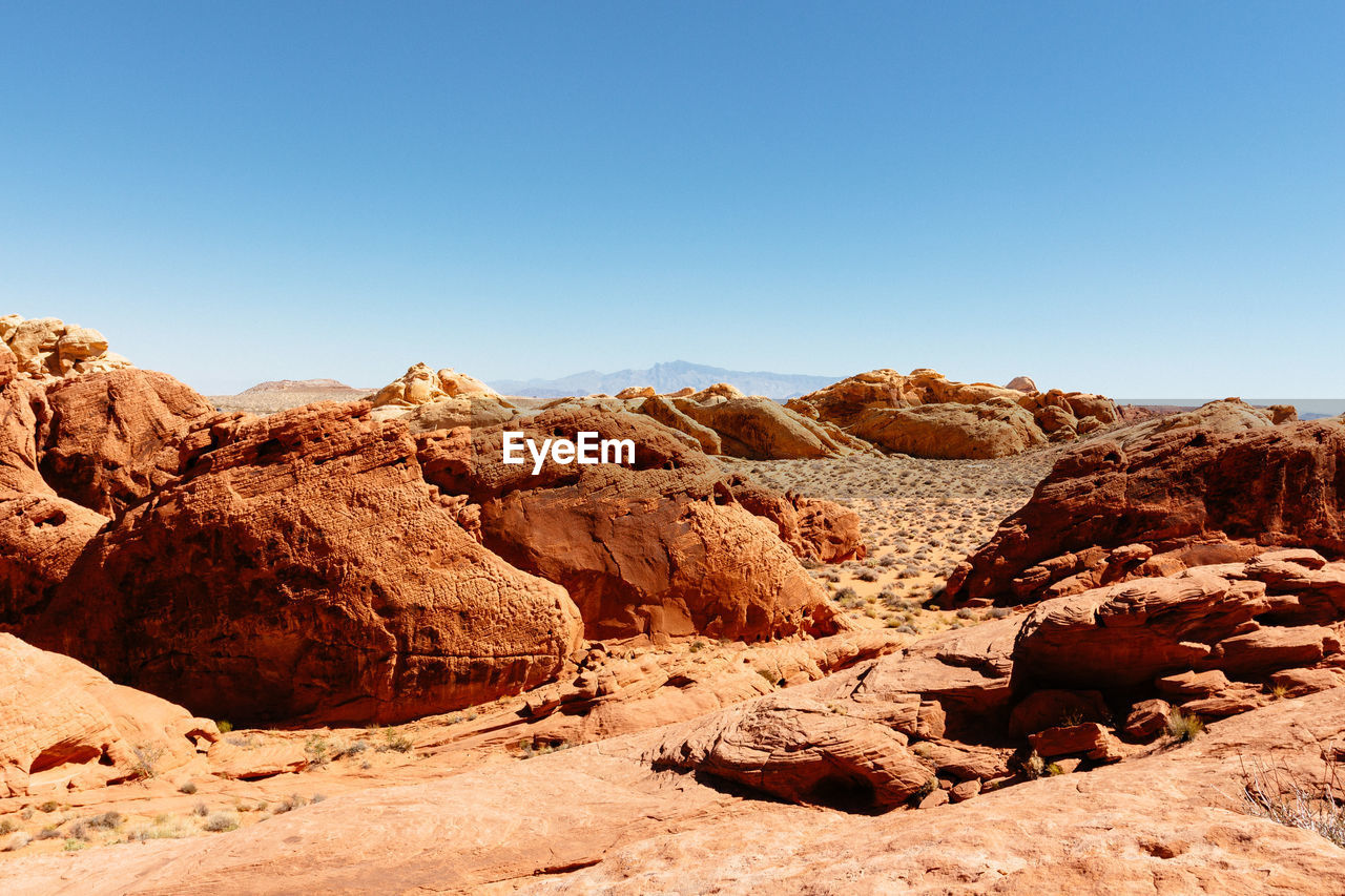 Rock formations in desert against clear sky