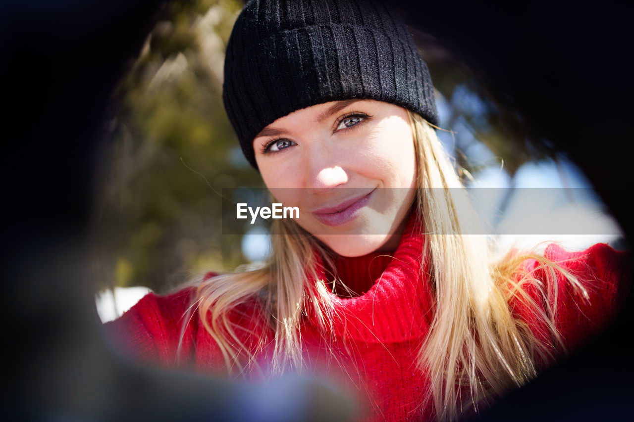 Portrait of smiling young woman in winter