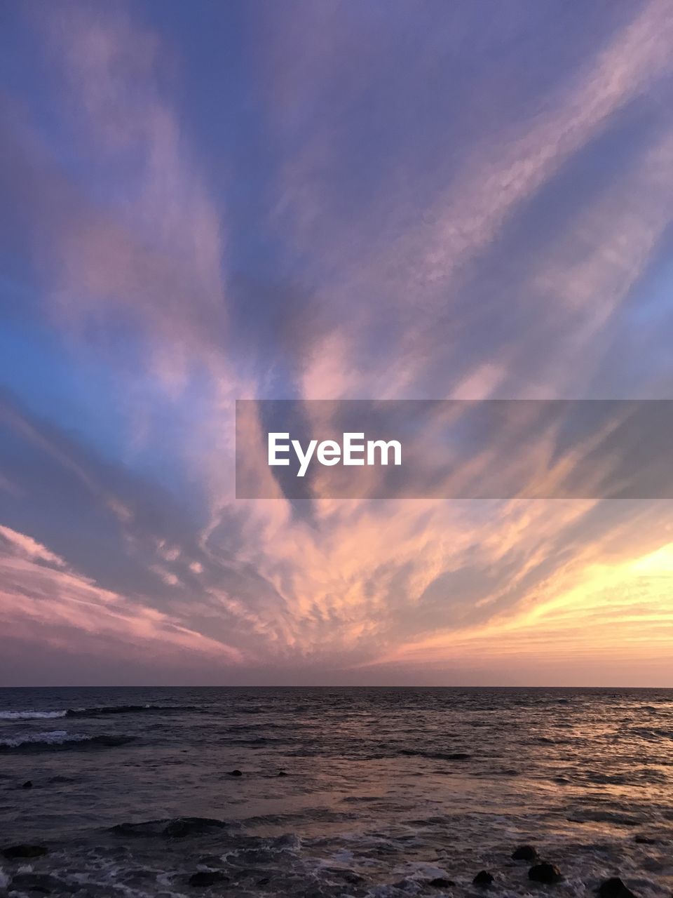 Scenic view of sea against sky at sunset