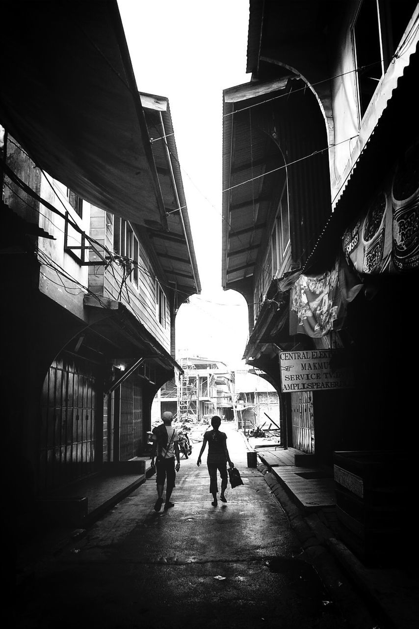 People walking in alley