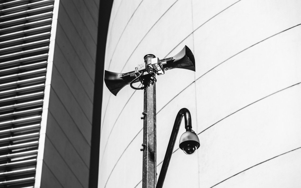 Low angle view of megaphones against buildings