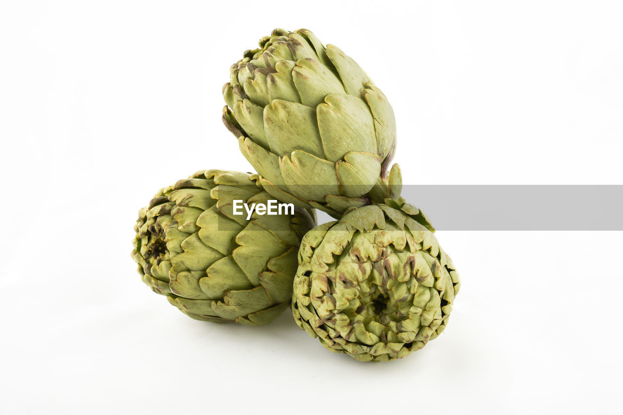 Close-up of artichoke against white background
