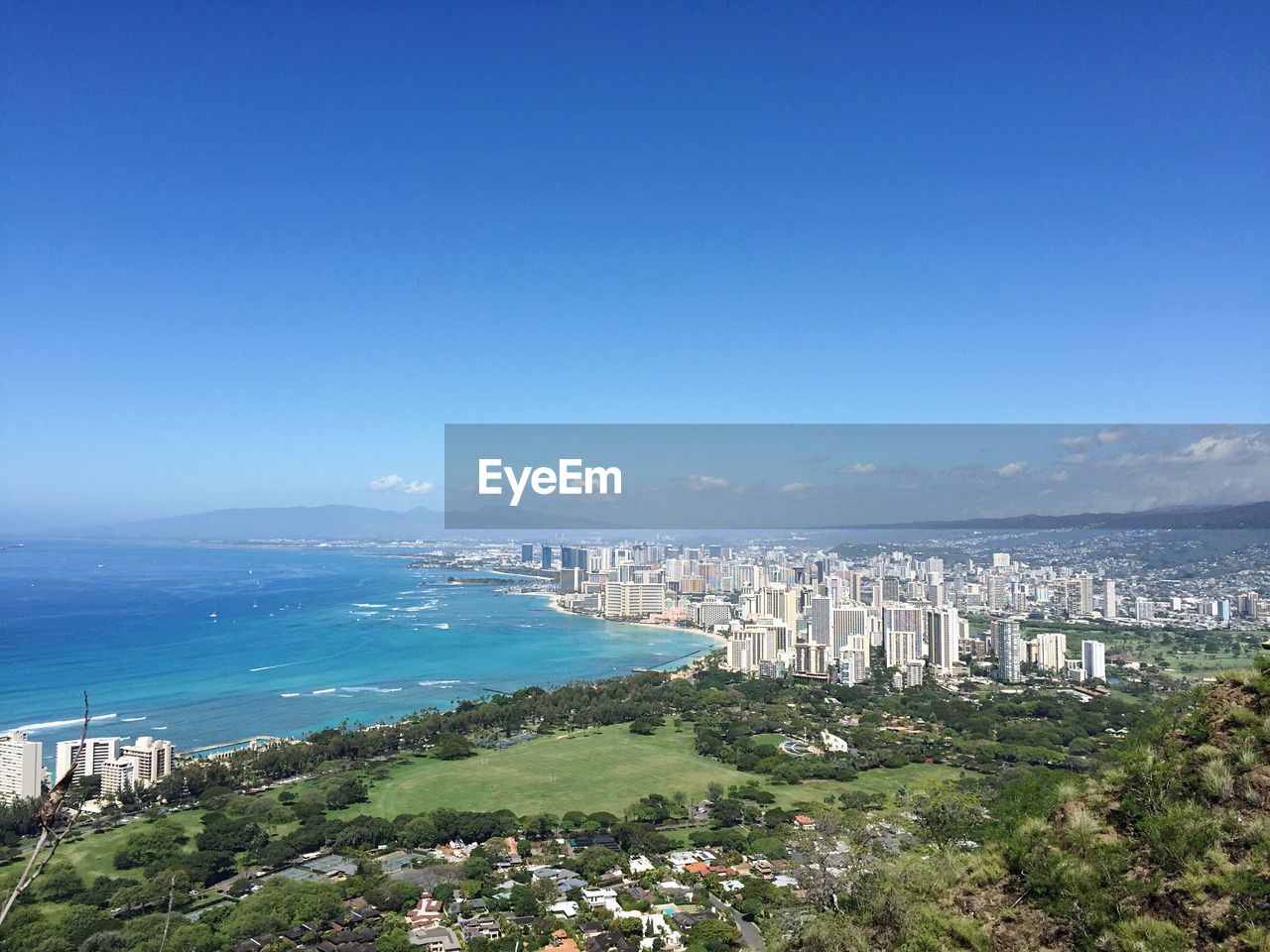 Scenic view of sea against clear blue sky