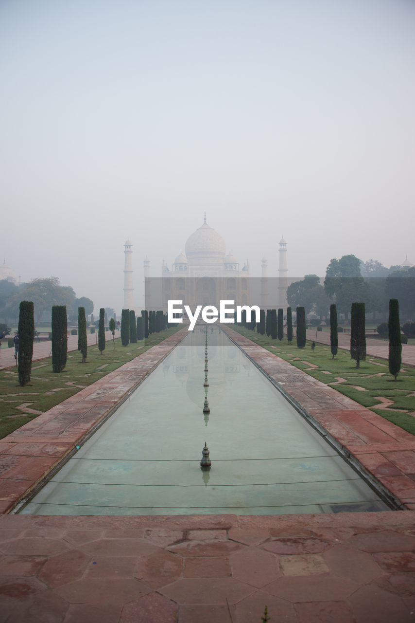 Reflecting pool with taj mahal in background