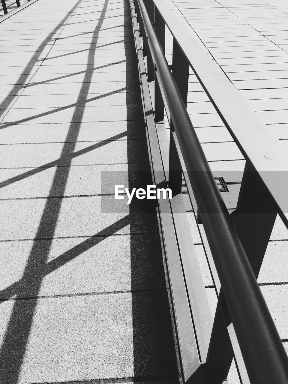 High angle view of railing on walkway