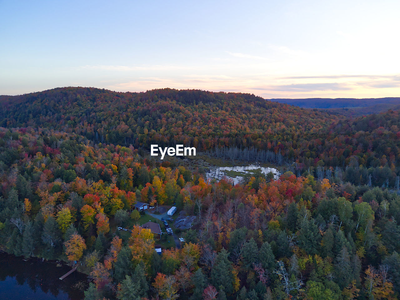 SCENIC VIEW OF AUTUMN TREES AGAINST SKY