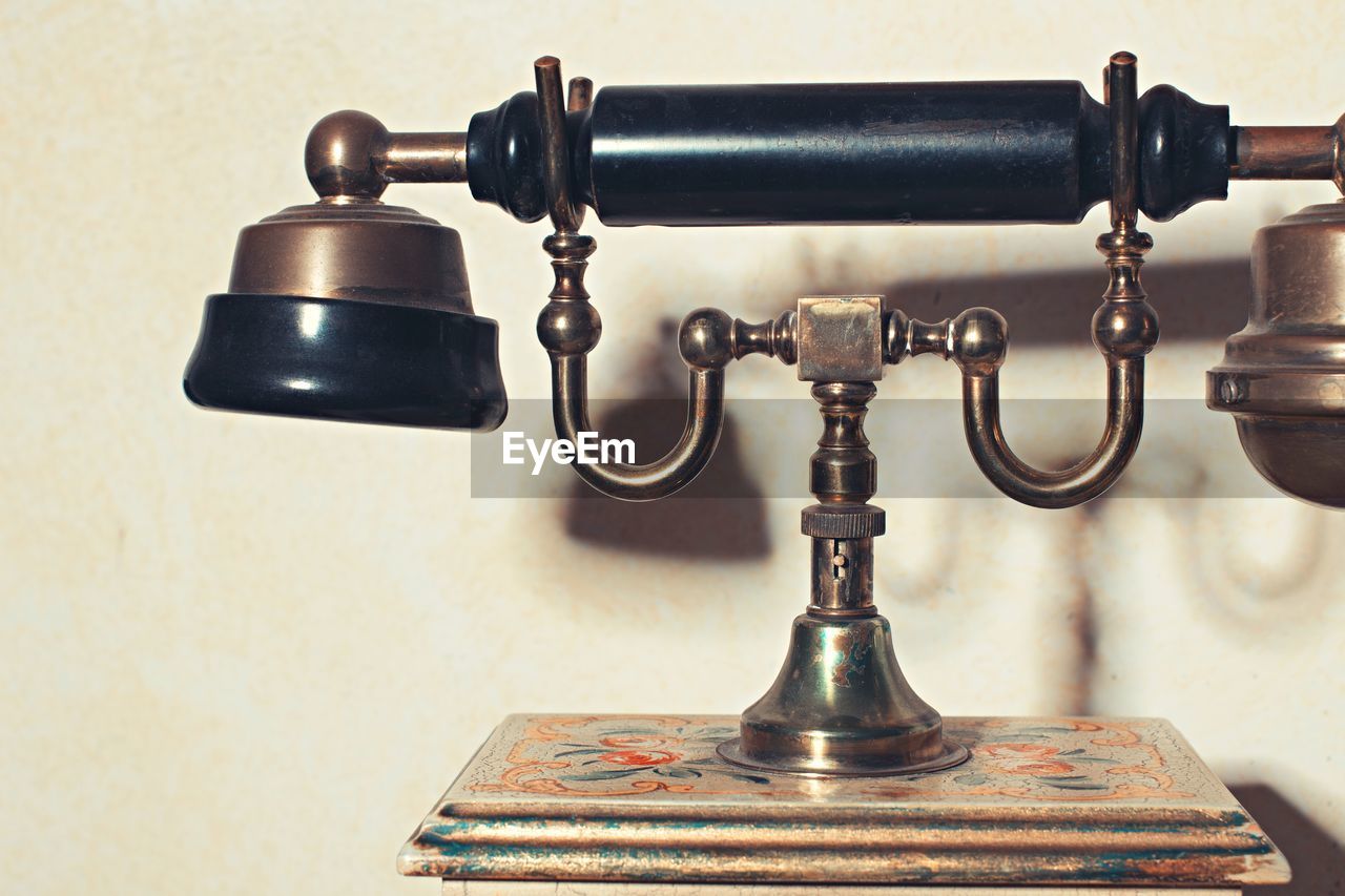 Close-up of rotary phone on table