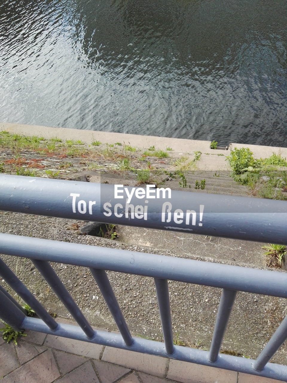 High angle view of text on railing